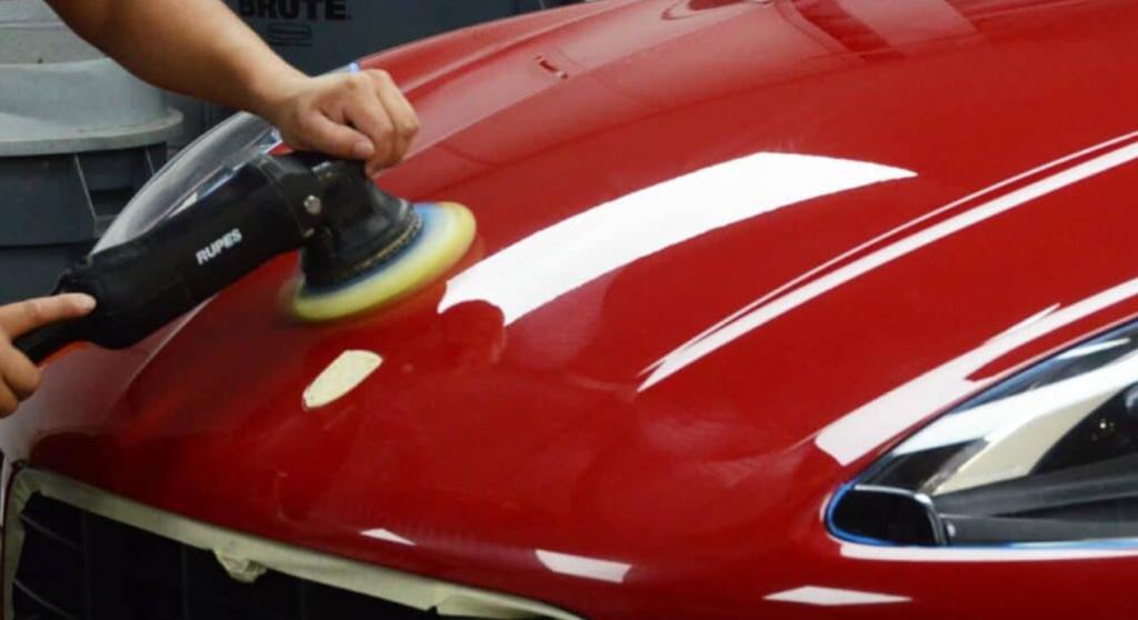 Professional mobile car detailer buffing hood of the car